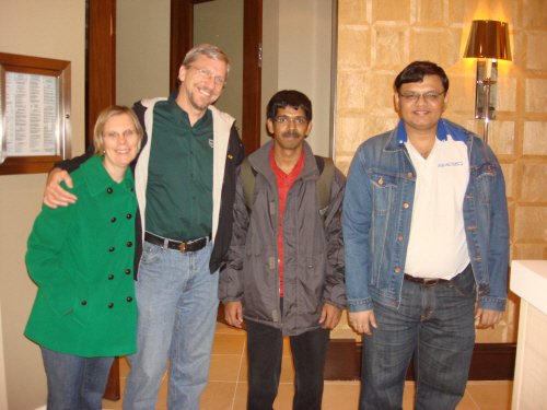 Group of four people at an indoor event..